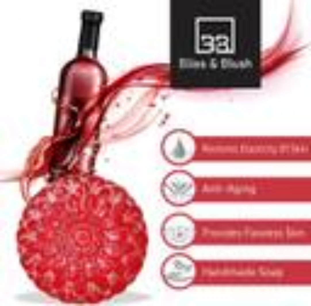 Red bottle with decorative elements and a label on a white background