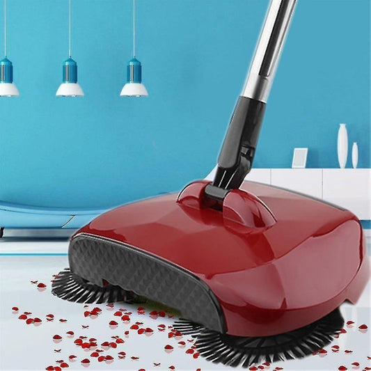 Red floor cleaning brush with black bristles on a blue wall background