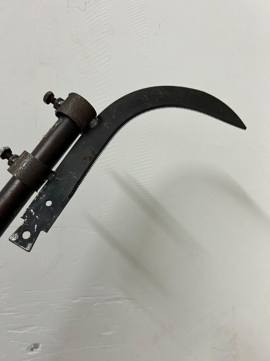 Vintage sickle on a white background