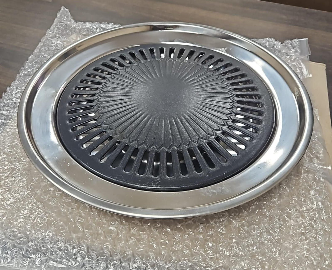 Stainless steel grill pan on a bubble-wrapped surface