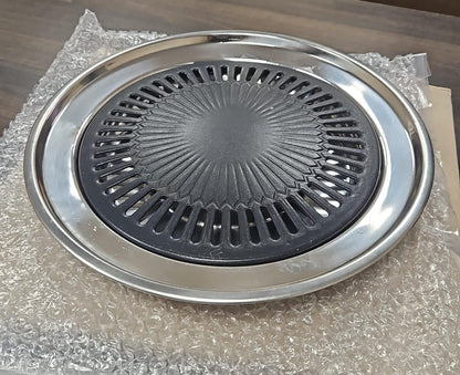 Stainless steel grill pan on a bubble-wrapped surface