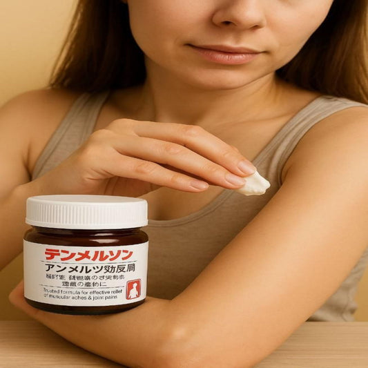 Woman applying cream from a jar to her arm with a beige background