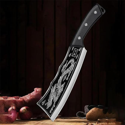 Decorative knife with a dragon design on a wooden surface with vegetables.