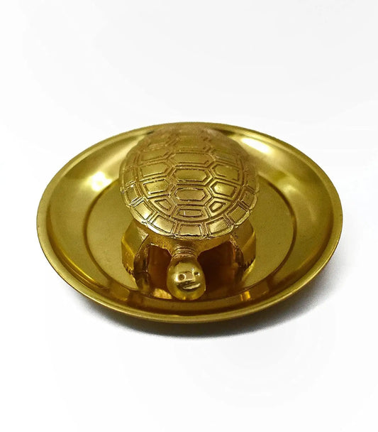 Gold turtle-shaped object on a white background
