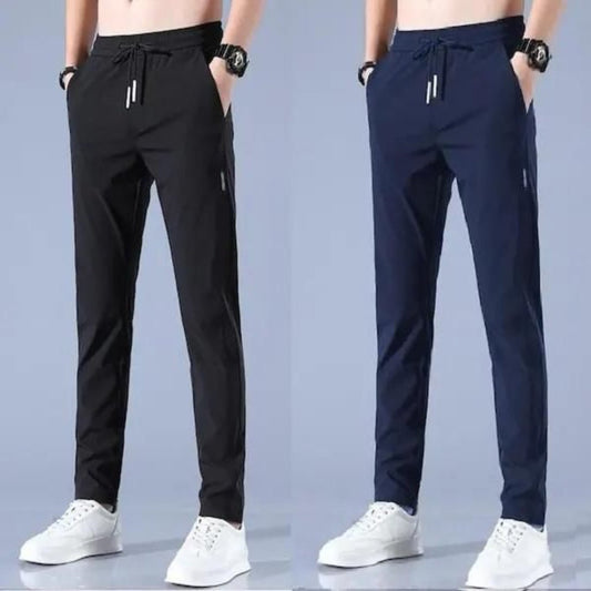 Two pairs of men's track pants, one pair in black and one pair in blue, both with drawstrings and side pockets.