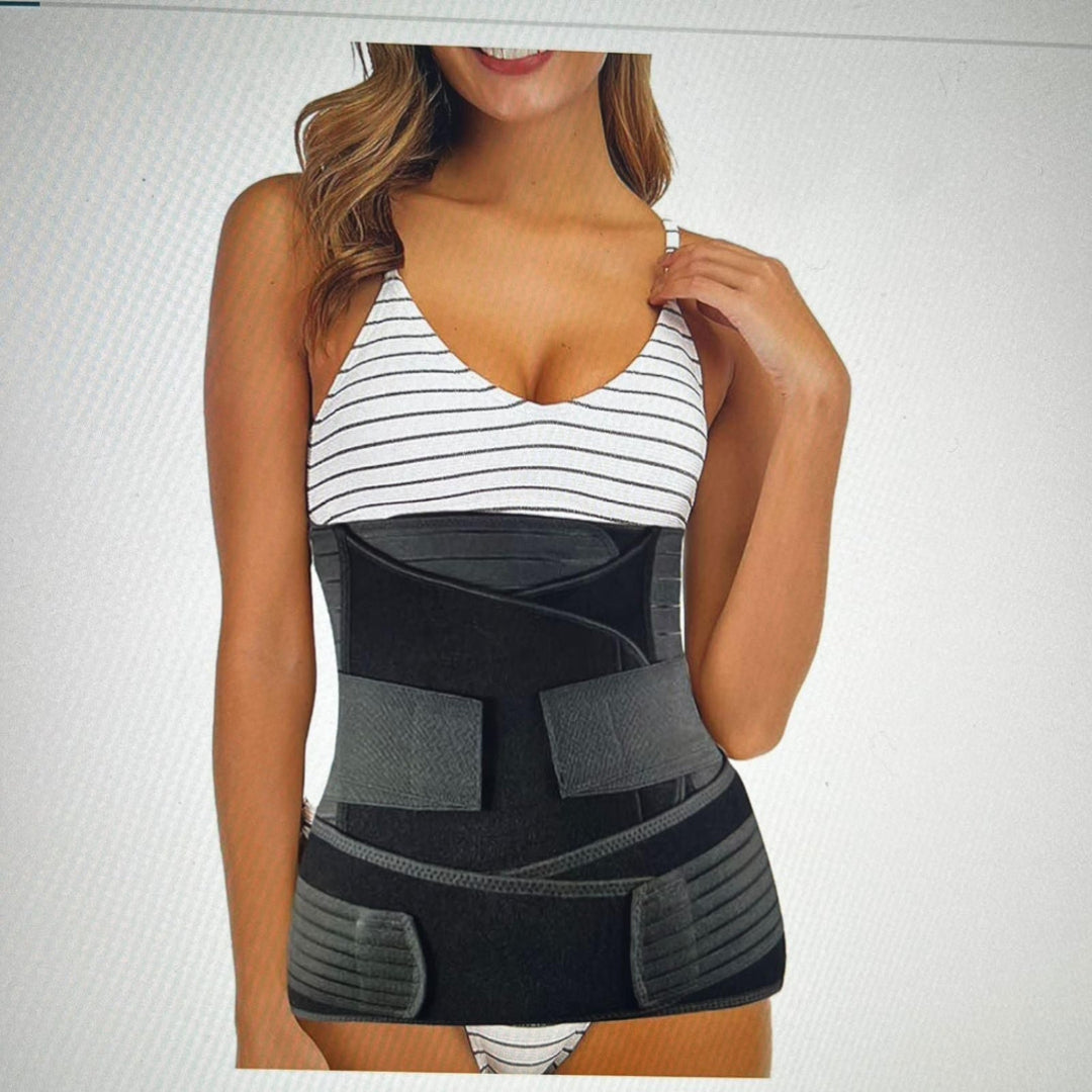 Woman wearing a black waist trainer against a light gray background