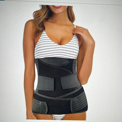 Woman wearing a black waist trainer against a light gray background