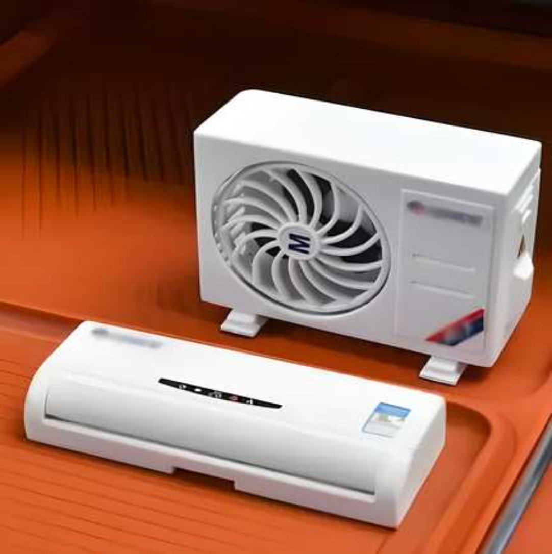 A white miniature air conditioner designed solar-powered car air freshener diffuser, placed on a red surface.