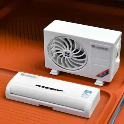 A white miniature air conditioner designed solar-powered car air freshener diffuser, placed on a red surface.