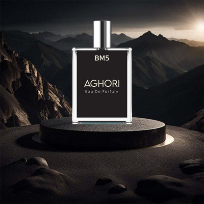 A bottle of AGHORI Eau De Parfum perfume placed on a pedestal with a mountainous backdrop.