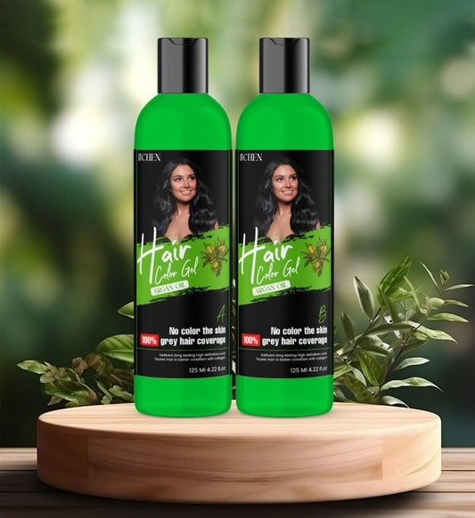 Two bottles of Kern Hair Color Gel with a green label, displayed on a wooden table with a background of greenery, indicating 100% gray hair coverage.