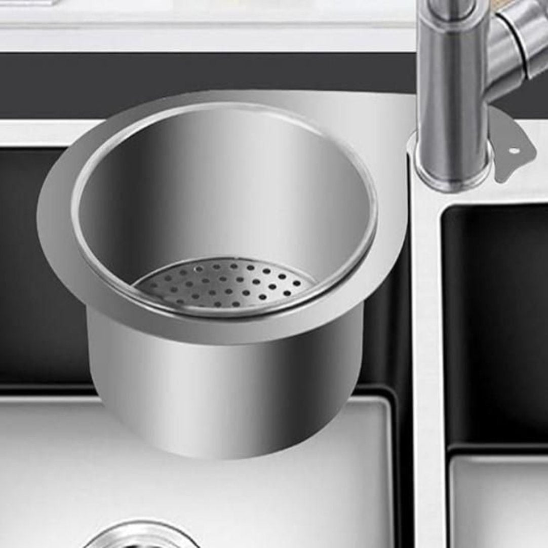 Stainless steel swan-shaped drain basket fitted into a kitchen sink, designed to catch food particles and prevent clogs.