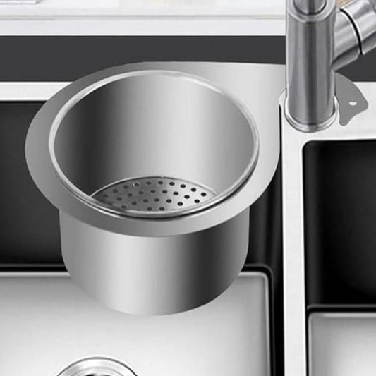 Stainless steel swan-shaped drain basket fitted into a kitchen sink, designed to catch food particles and prevent clogs.