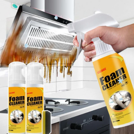Foam cleaner being used to clean a greasy kitchen exhaust hood.