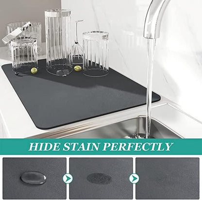 Gray mat on a kitchen sink with glasses and cleaning solution, text 'Hide Stain Perfectly'.