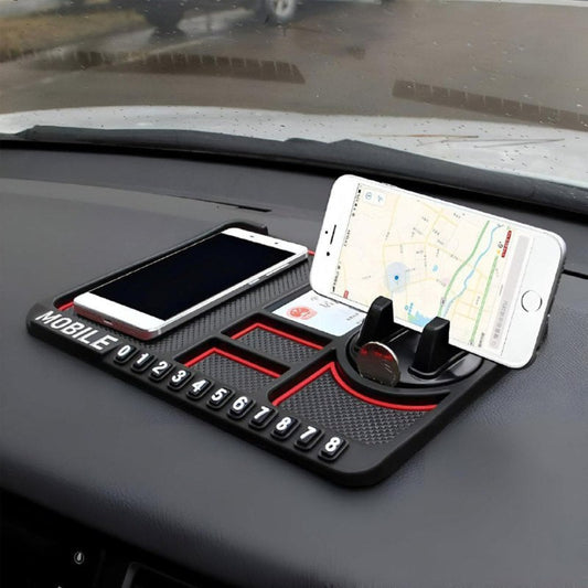 Car dashboard with a phone holder and two smartphones on a rainy day.