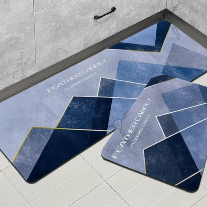 Blue geometric-patterned rug on a tiled floor with 'Feather Carpet' branding.