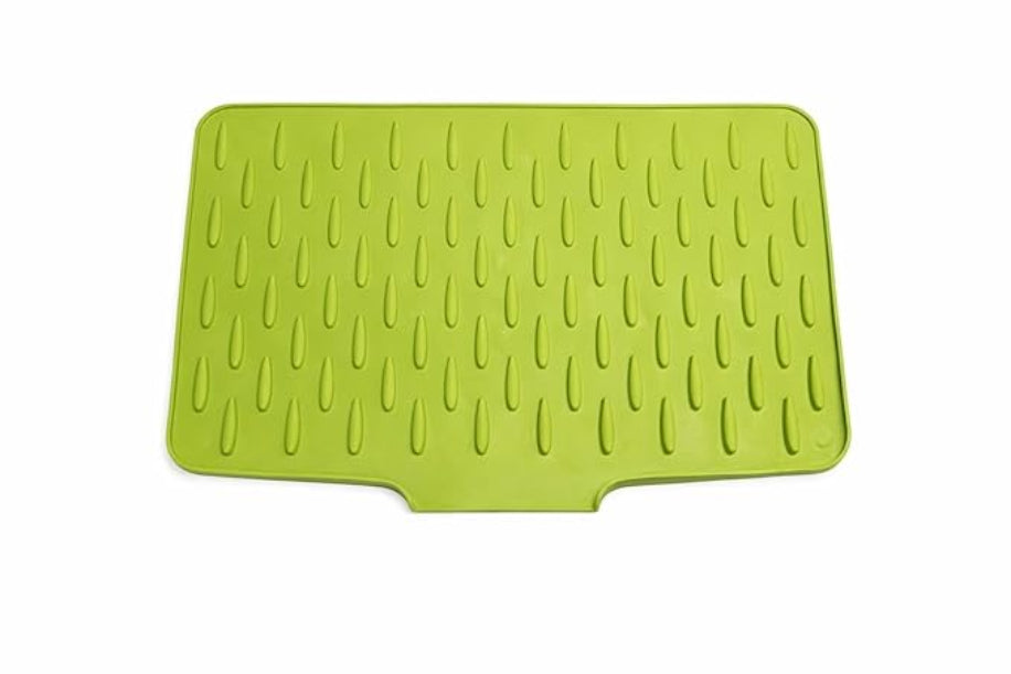 Green silicone mat with textured surface on a white background