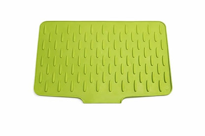Green silicone mat with textured surface on a white background