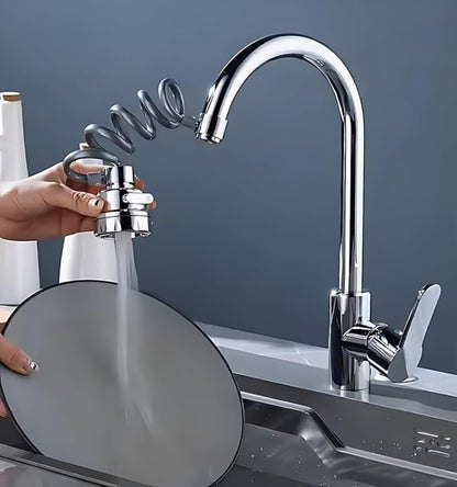 Person using a kitchen faucet with a handheld showerhead to clean a pot under running water.