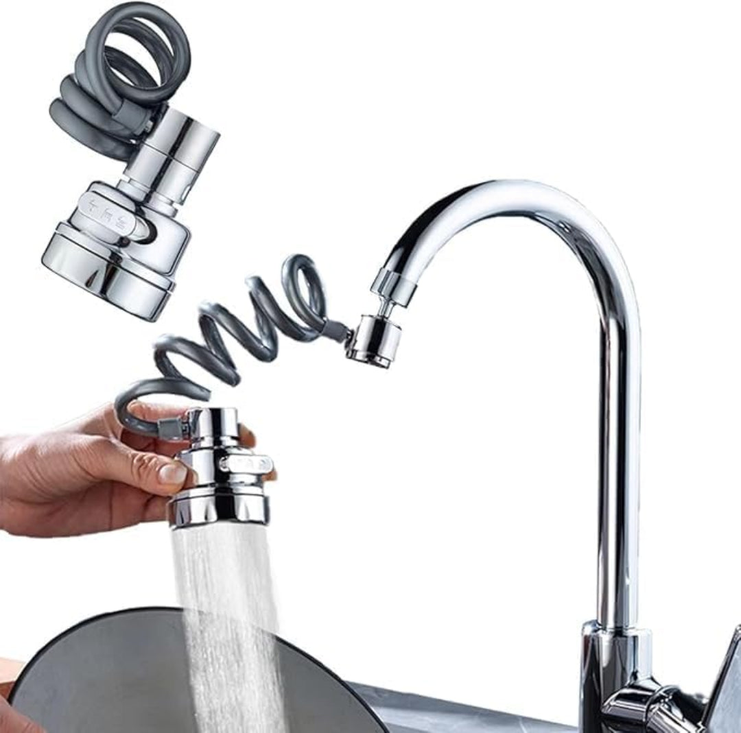 Chrome kitchen faucet with a handheld shower head attachment on a white background