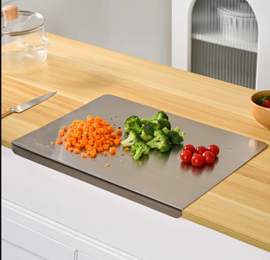 Chopping board with chopped vegetables on a kitchen counter