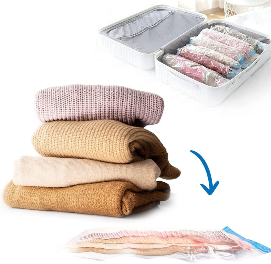 Stack of folded clothes next to a transparent storage bag with rolled-up clothes inside on a white background.
