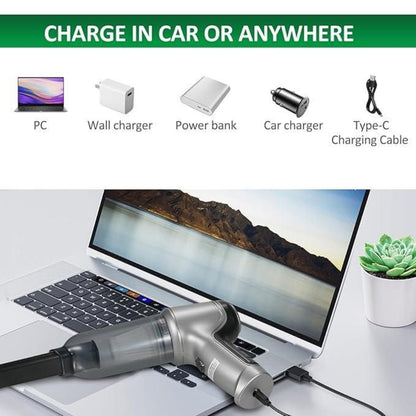 Laptop with multiple charging devices and cables displayed on a white surface.