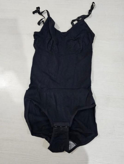 Black swimsuit on a hanger against a white background