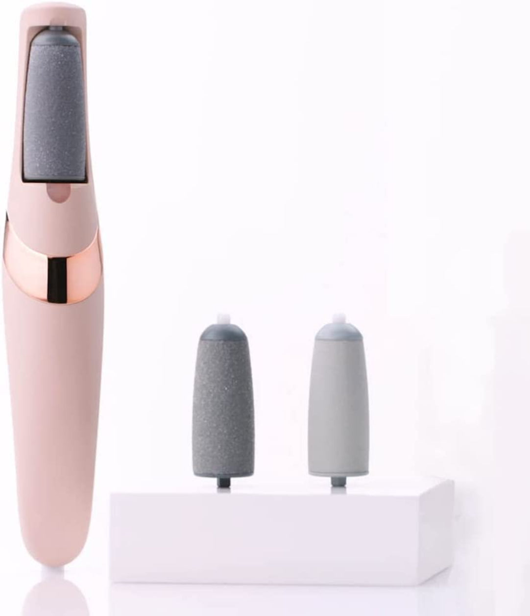 Pink and rose gold skin care tool with interchangeable heads on a white background