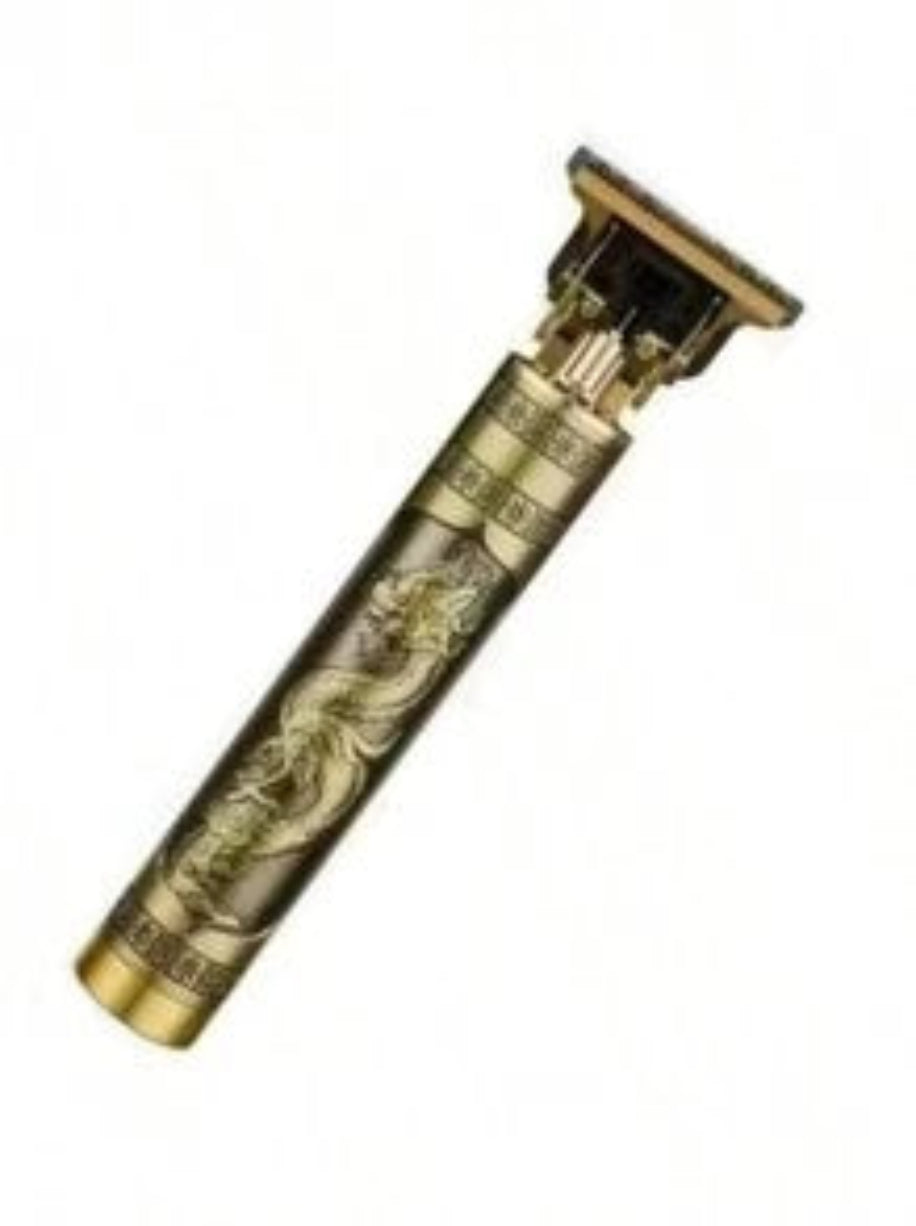 Vintage gold and black hair clipper on a white background