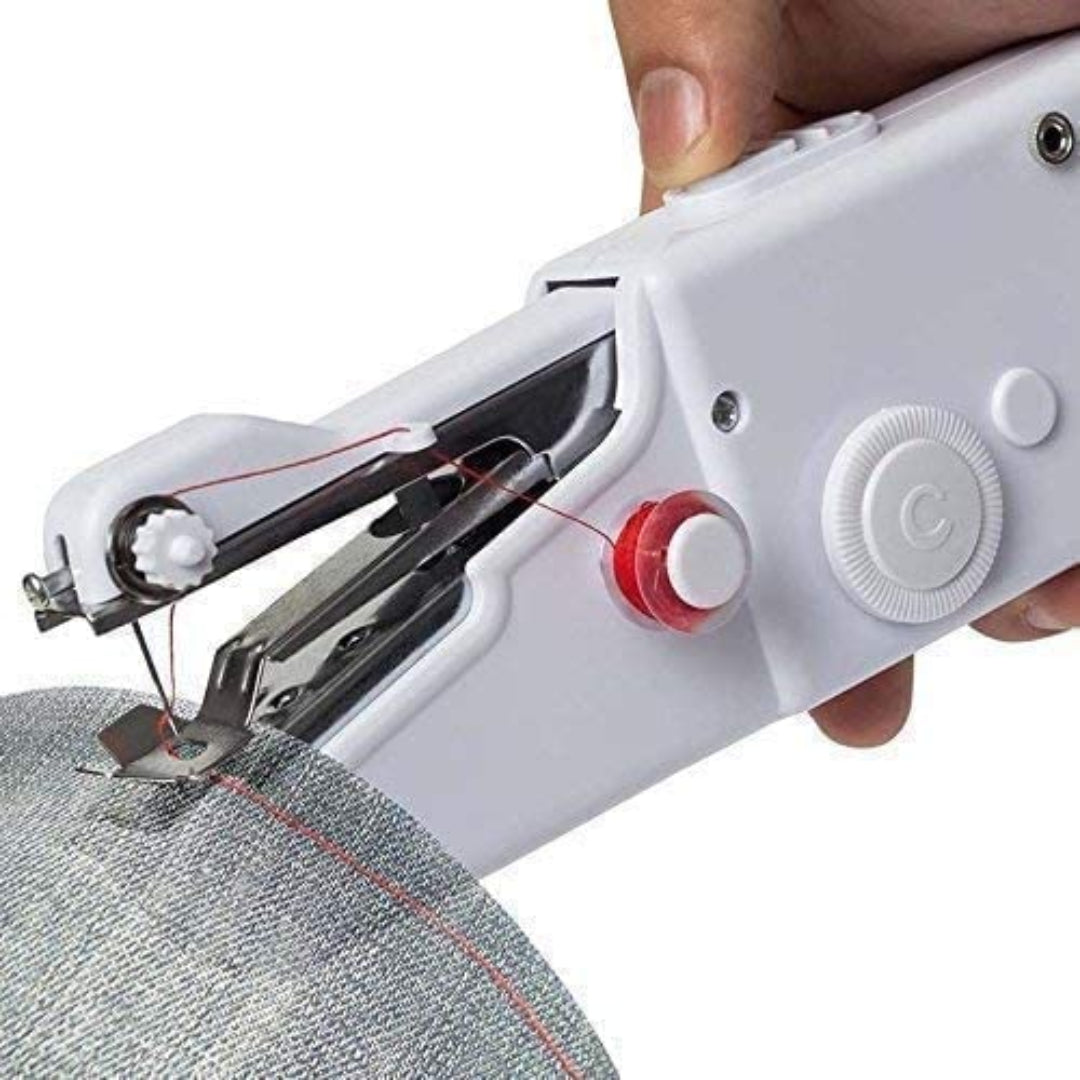 Handheld sewing machine in use on a piece of fabric
