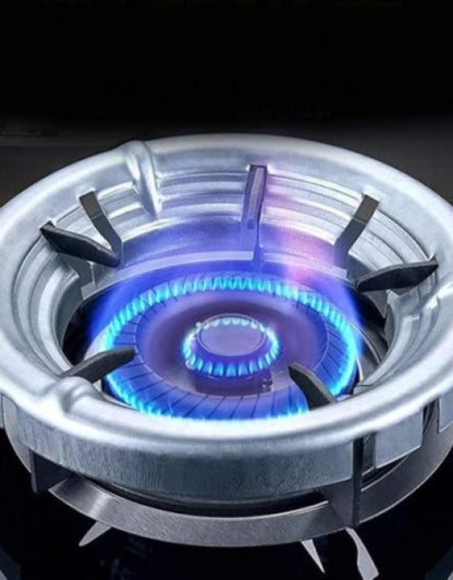 Gas stove burner with blue flame on a black background