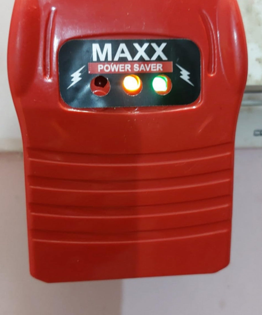 Red 'MAXX Power Saver' device with two indicator lights on a white background