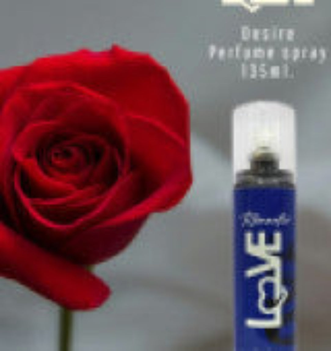 Red rose next to a perfume spray bottle labeled 'LOVE' on a gray background