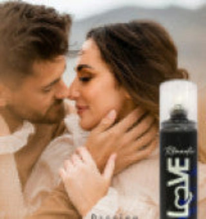Couple embracing with a bottle of Love perfume in the foreground