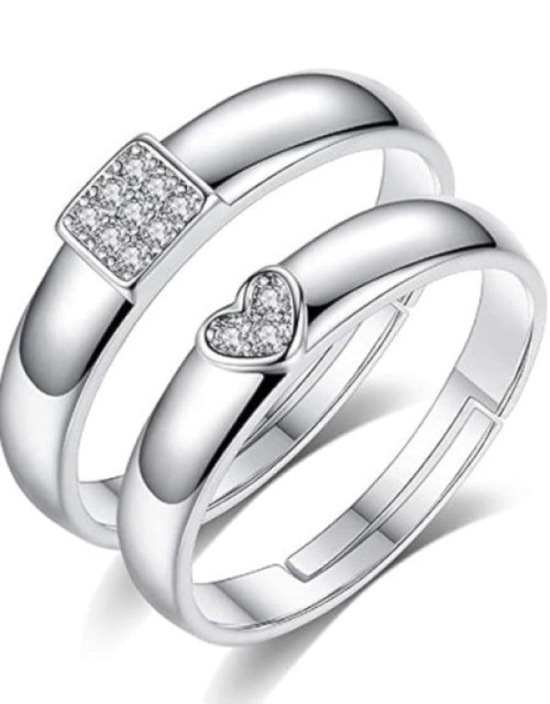 A set of silver-plated adjustable couple rings, featuring cubic zirconia studs, designed for engagements, weddings, and anniversaries.