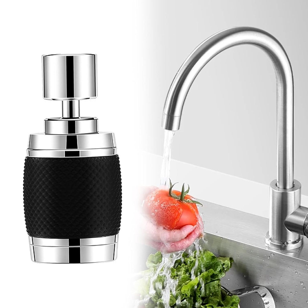 Chrome kitchen faucet with black handle next to a sink with vegetables being washed.